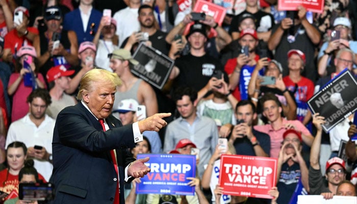 Former US President and 2024 presidential nominee Donald Trump gestures as he speaks during a campaign rally with US Senator and vice presidential nominee J.D. Vance at Van Andel Arena in Grand Rapids, Michigan, on July 20, 2024. — AFP