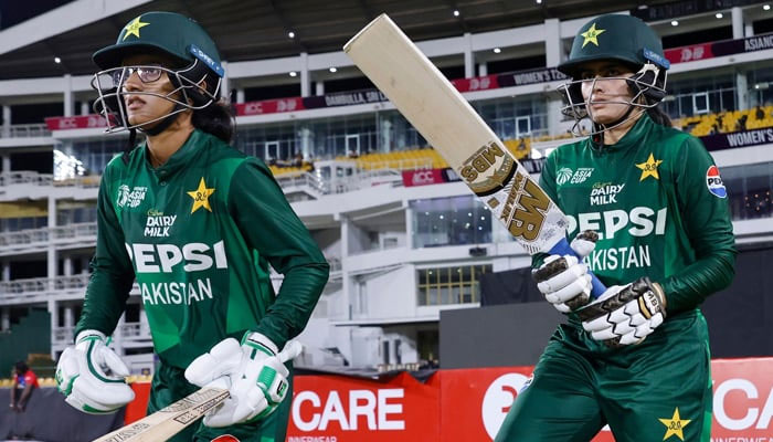 Muneeba Ali (L) and Gul Feroza enter the field for 2024 Womens Asia Cup match on July 21, 2024. — PCB