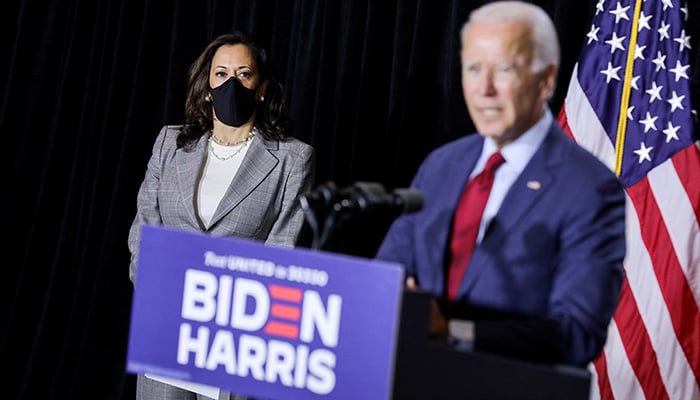 Democratic US vice presidential candidate Kamala Harris listens as Democratic US presidential candidate Joe Biden during a press conference in Wilmington, Delaware, August 13, 2020. — Reuters/File