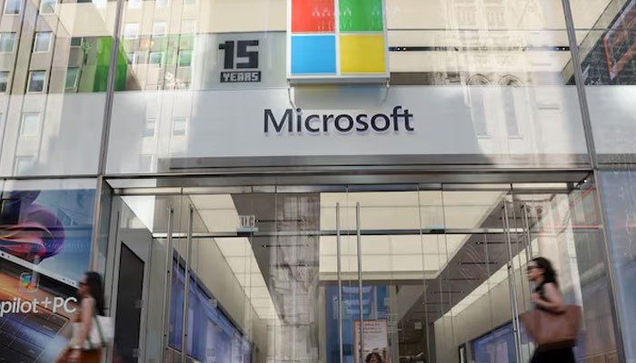 Pedestrians walk past a Microsoft Experience Center, following a global IT outage, in New York City, US July 19, 2024. — Reuters