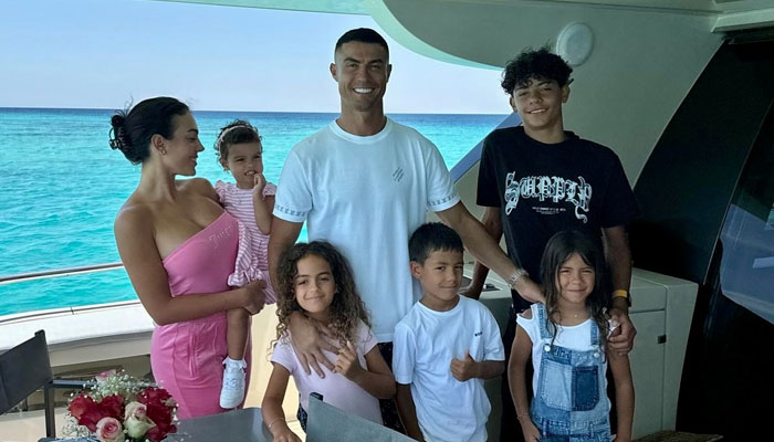 Portuguese football legend Cristiano Ronaldo (centre) and his partner Georgina Rodriguez (left) pose for a family photo wioth their children during their vacation in Saudi Arabia. — Instagra,/@cristiano