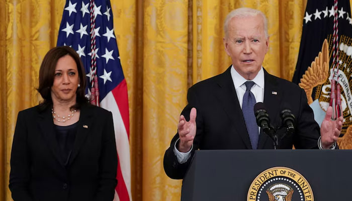 US President Joe Biden (right) speaks next to Vice President Kamala Harris before signing the COVID-19 Hate Crimes Act into law, in the East Room at the White House in Washington DC, US on May 20, 2021 — Reuters