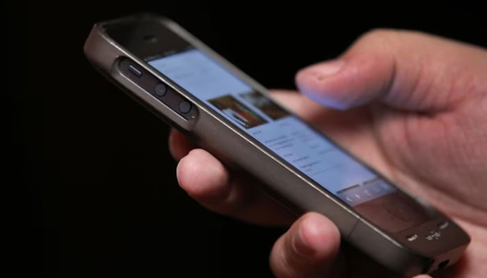 A representational image showing a person using a smartphone. — Reuters/File