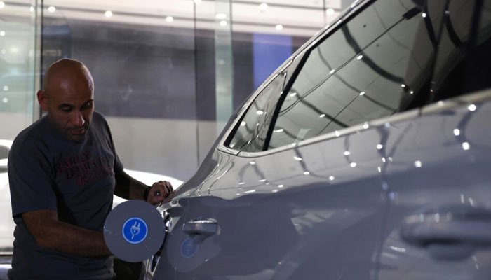 A person fills fuel in a car in Saudi Arabia. — AFP/File