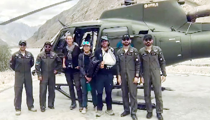 Pakistan Army soldiers with foreign climbers after the rescue operation. — Radio Pakistan/File