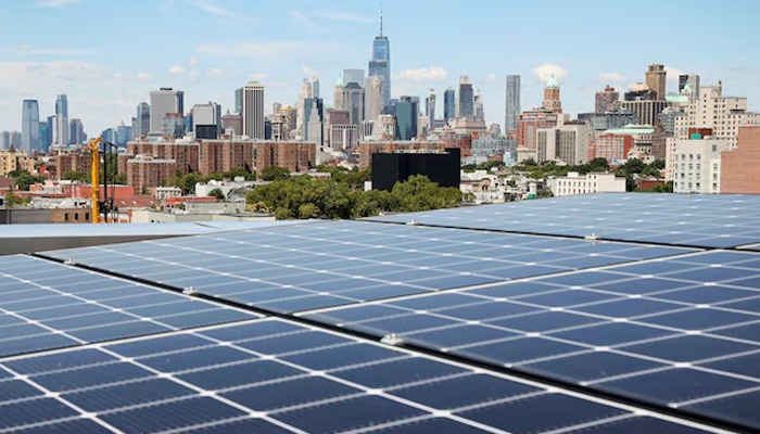 Solar panels are seen along with a view of the neighbourhood and lower Manhattan from the rooftop of Timber House, the citys first mass-timber condo building, in the Park Slope neighbourhood of Brooklyn, New York, US, August 16, 2022. — Reuters