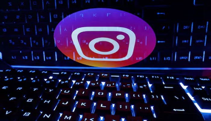 A keyboard is placed in front of a displayed Instagram logo in this illustration taken February 21, 2023. —Reuters