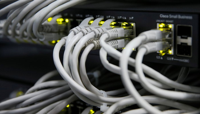 Ethernet cables used for internet connection are seen at an office. — Reuters