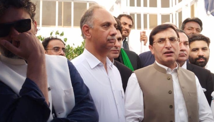 PTI leaders Omar Ayub (centre) and Gohar Khan (right) in Islamabad on June 24, 2024. —Facebook/ @OmarAyubKhan.Official