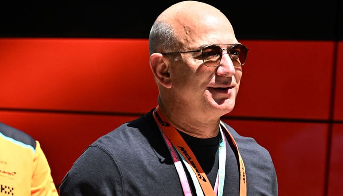 Founder of Amazon, Jeff Bezos arrives in the paddock before the qualyfying sessions for the 2023 Miami Formula One Grand Prix at the Miami International Autodrome in Miami Gardens, Florida, on May 6, 2023. — AFP