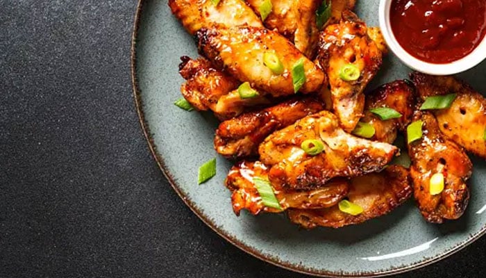 This representational image shows a plate of chicken wings. — Unsplash