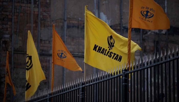 Flags, promoting the movement seeking to create a homeland for Sikhs by establishing a sovereign state called Khalistan, flap in the air outside Guru Nanak Gurdwara, in Smethwick, near Birmingham, central England, on October 18, 2023. —AFP