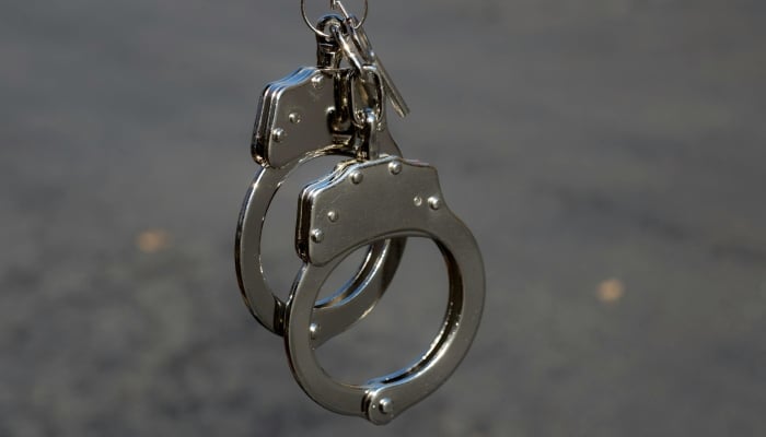 A representational image of handcuffs. — Pexels