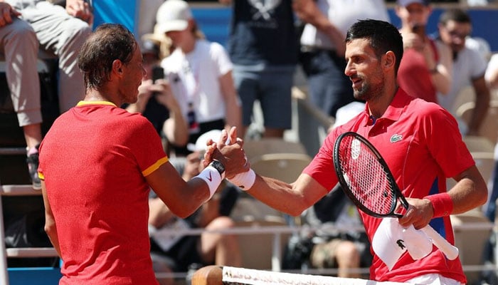 Novak Djokovic of Serbia and Rafael Nadal of Spain shake hands after their match in Roland-Garros Stadium, Paris, France, July 29, 2024. — Reuters