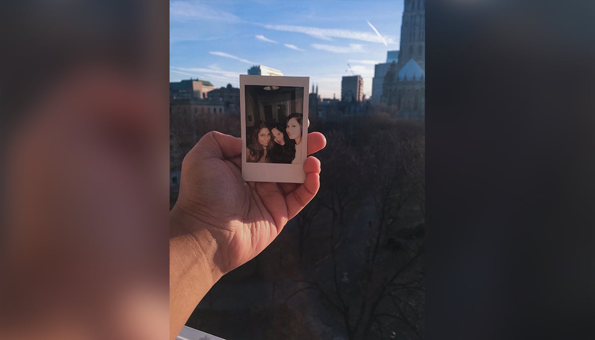 A polaroid of the author and her two friends Simrit and Rupal. — Author