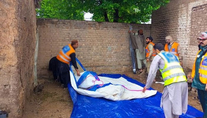 In this file image, rescue personnel can be seen working. — Geo News/File