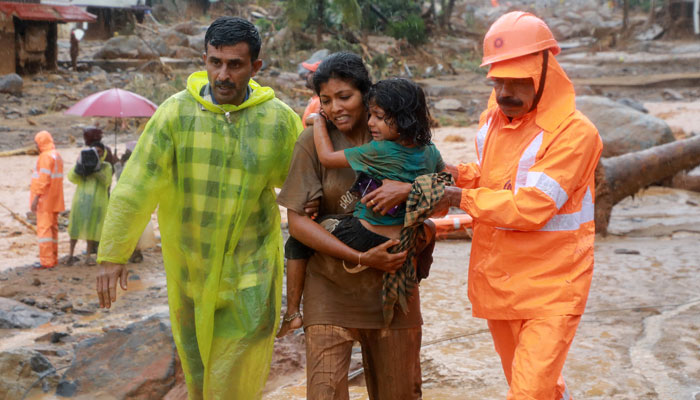 Rescuers help residents to move to a safer place, at a landslide site after multiple landslides in the hills, in Wayanad, in the southern state of Kerala, India, July 30, 2024. — Reuters