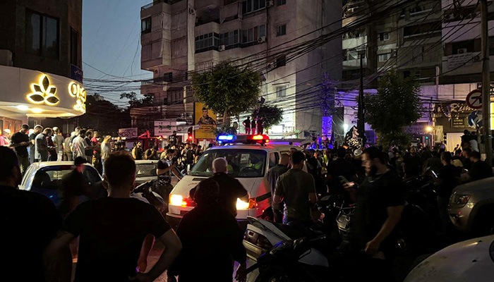 People gather near a site hit by what security sources said was a strike on Beiruts southern suburbs, Lebanon July 30, 2024. — Reuters