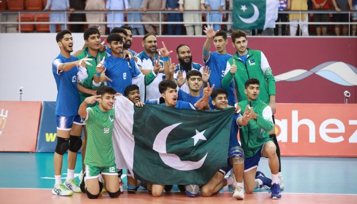 Pakistan volleyball team players and officials pose for a picture during the 15th Asian Mens U18 Volleyball Championship in Bahrain. — Reporter