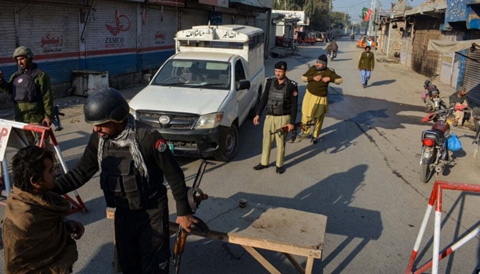 Police arrest people at a checkpoint in Bannu, Khyber Pakhtunkhwa, Pakistan. AFP/File