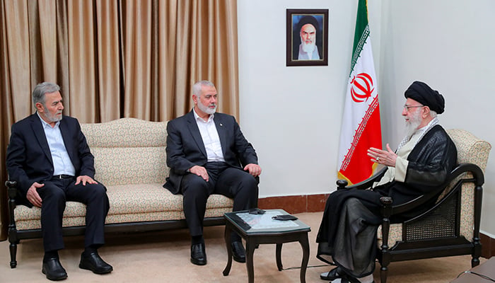 Leader Ayatollah Ali Khamenei meets with Palestinian group Hamas top leader Ismail Haniyeh (centre) in Tehran, Iran July 30, 2024. — Reuters