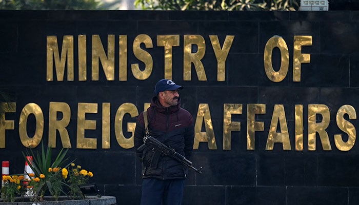 A security personnel stands guard outside the office of the Ministry of Foreign Affairs in Islamabad. — AFP/File