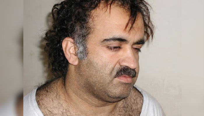 Khalid Sheikh Mohammed is shown in this file photograph during his arrest on March 1, 2003. — Reuters