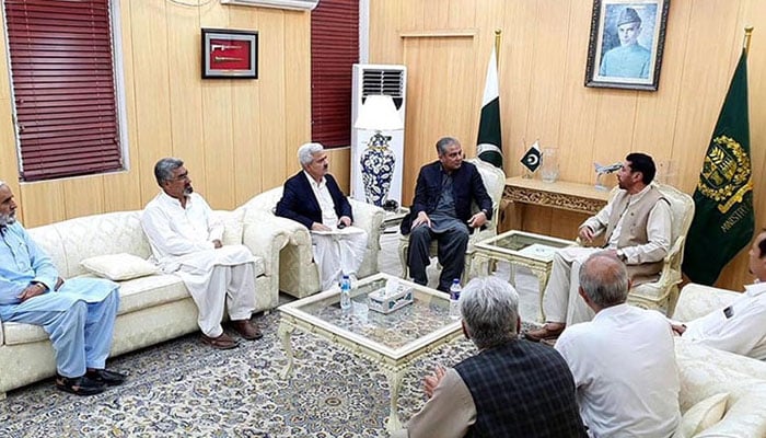 Interior Minister Mohsin Naqvi (centre left) meets a delegation from Kurram led by MNA Hamid Hussain (centre right) in Islamabad in this image released on August 1, 2024. — State media