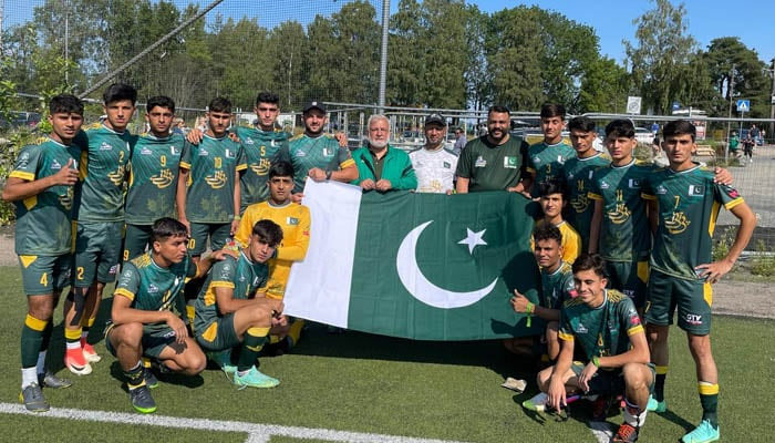 Pakistan Street Child Football Team gesture together for a group photo. — Reporter