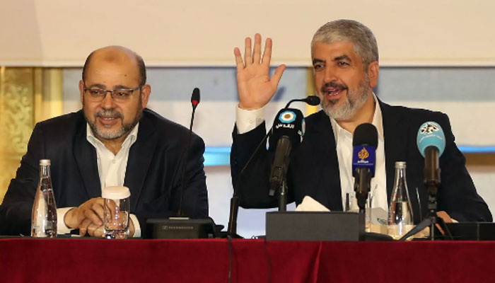 Khaled Meshaal (right) with Musa Abu Marzuk in the Qatari capital Doha on May 1, 2017. — AFP