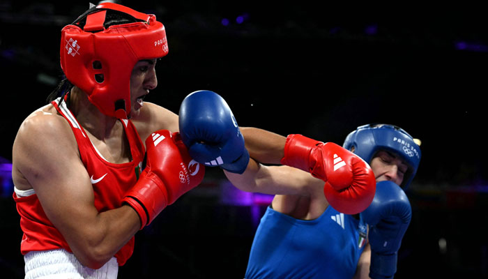 Algeria’s Imane Khelif (in red) punches Italy’s Angela Carini in the women’s 66kg preliminaries round of 16 boxing match during the Paris 2024 Olympic Games at the North Paris Arena, in Villepinte on August 1, 2024. — AFP