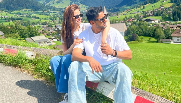 Actress Sana Javed poses with her husband and veteran cricketer Shoaib Malik in Switzerland. — Instagram/@sanajaved.official