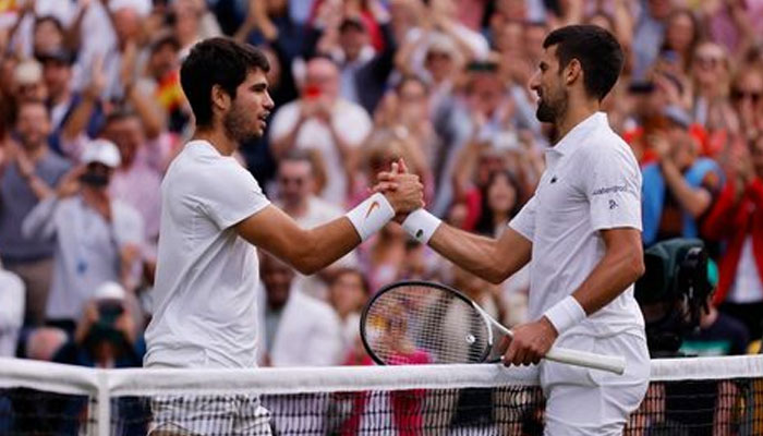 Spains Carlos Alcaraz (left) shakes hands with Serbias Novak Djokovic at the Wimbledon final played at All England Lawn Tennis and Croquet Club, London, Britain on July 16, 2023. — Reuters