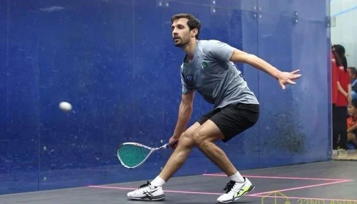 Pakistans rising squash player Nasir Iqbal during a match. — APP/File