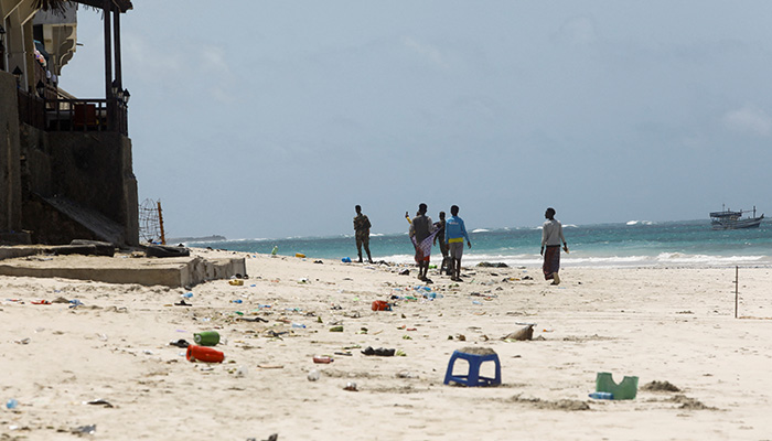 People walk at the scene of an explosion that occurred while revellers were swimming at the Lido beach in Mogadishu, Somalia August 3, 2024. — Reuters