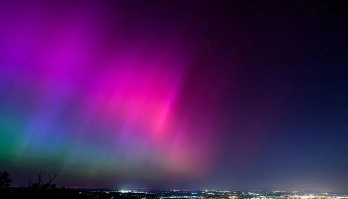 Northern lights over the night sky in Vienna on May 11, 2024. — AFP