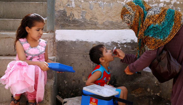 A boy receives polio vaccine drops, during an anti-polio campaign, in a low-income neighbourhood in Karachi, Pakistan April 9, 2018. — Reuters