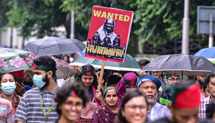 Protesters are seen participating in a demonstration in Dhaka, Bangladesh. — AFP