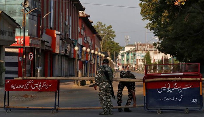 Indian Central Reserve Police Force officers put up a roadblock on an empty street during a lockdown on the first anniversary of the revocation of occupied Jammu abd Kashmirs autonomy, in Srinagar August 5, 2020. — Reuters