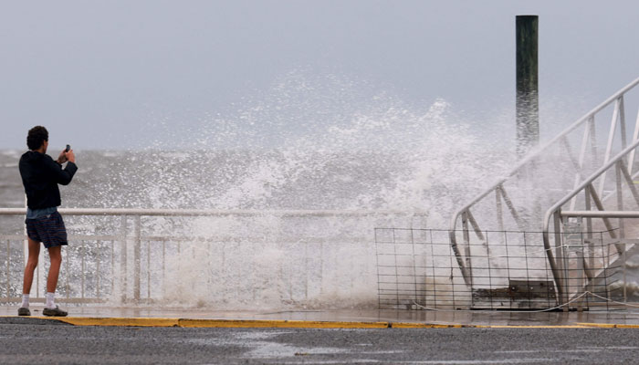 A wave crashes ashore as the region prepares for the possible arrival of Tropical Storm Debby, which is strengthening as it moves through the Gulf of Mexico on August 04, 2024 in Cedar Key, Florida. — AFP