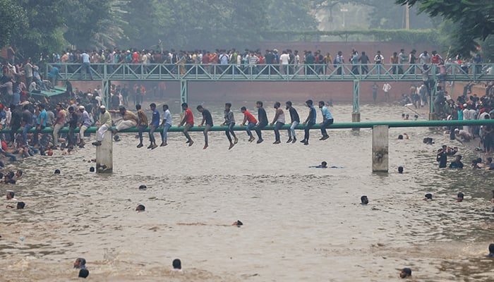 People swim in the lake inside Ganabhaban, the Prime Ministers residence, after the resignation of the Sheikh Hasina in Dhaka, Bangladesh, August 5, 2024. — Reuters