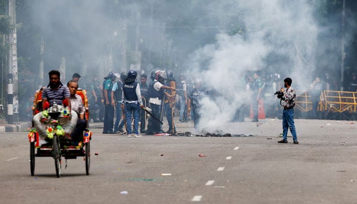 Smoke rises from a fire that was set on the street during a protest by students demanding the stepping down of Bangladeshi Prime Minister Sheikh Hasina, following quota reform protests, in Dhaka, Bangladesh, August 4, 2024. — Reuters