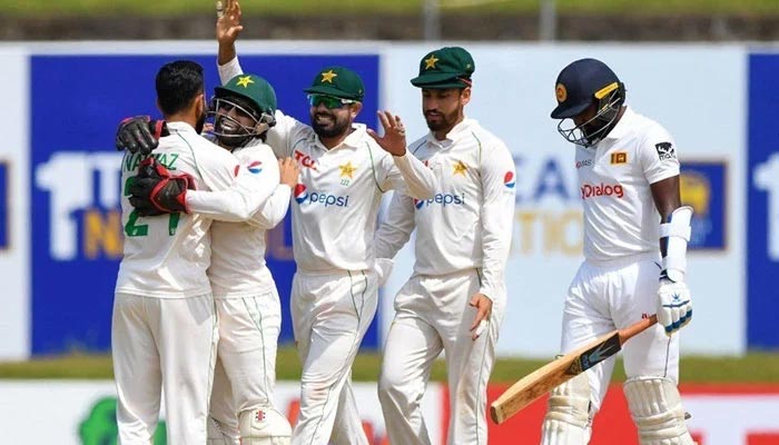 Pakistan players celebrate after taking a wicket during match against Sri Lanka. — AFP/File