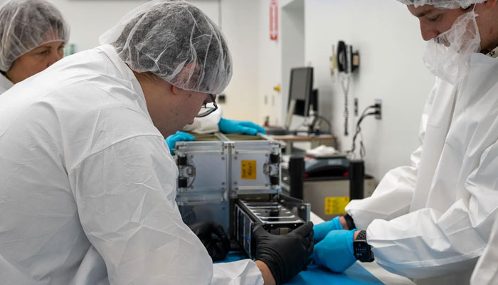 Technicians with the University of Kansas prepare their KUbeSat-1 for integration at Firefly’s Payload Processing Facility at Vandenberg Space Force Base, California, US on April 25, 2024. — Nasa