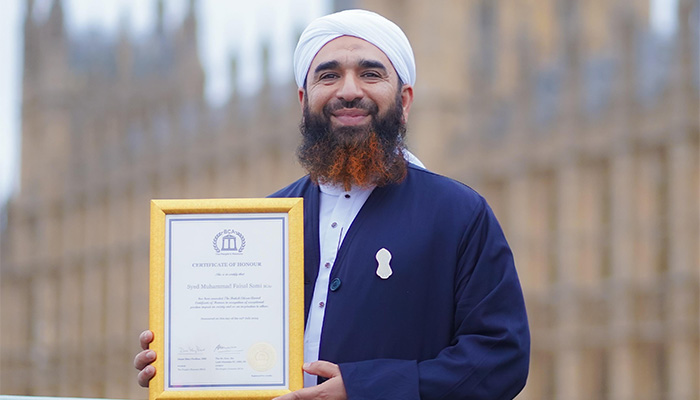 British Pakistani religious scholar Syed Muhammad Faisal Sami poses for the picture after receiving the British Citizen Award at the Palace of Westminster for community services. — Reporter