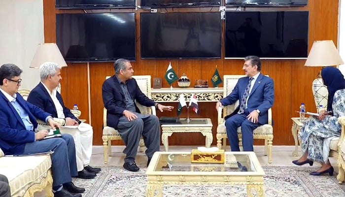 Interior Minister Mohsin Naqvi (centre left) and Iraqi Ambassador Hamid Abbas Lafta speak during the meeting in Islamabad on August 7, 2024. — Radio Pakistan