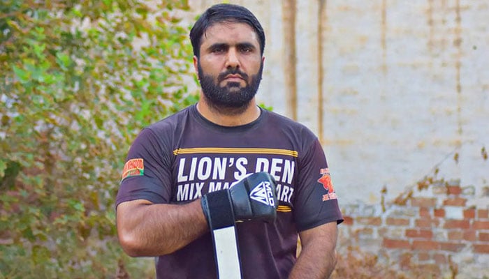 Irfan Mehsood, first Pakistani MMA athlete to hold 100 Guinness World records, gestures for a photograph shared on February 28, 2024. — Instagram/irfanmehsood.official