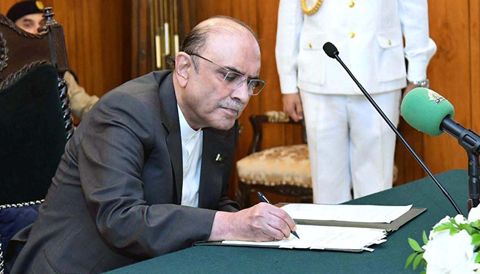 President Asif Ali Zardari signs a bill at the Aiwan-e-Sadr in Islamabad, on July 23, 2024. — APP