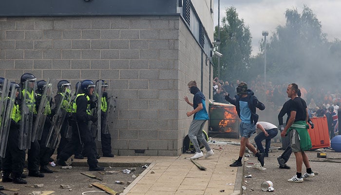 Demonstrators clash with police officers during an anti-immigration protest, in Rotherham, Britain, August 4, 2024. — Reuters