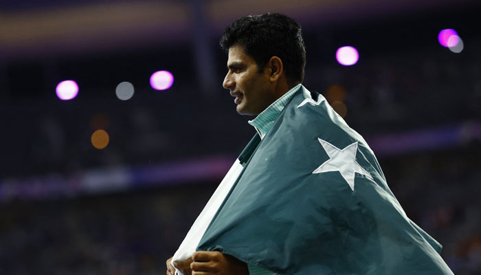 Arshad Nadeem of Pakistan celebrates after winning gold and setting a new Olympic record. — Reuters